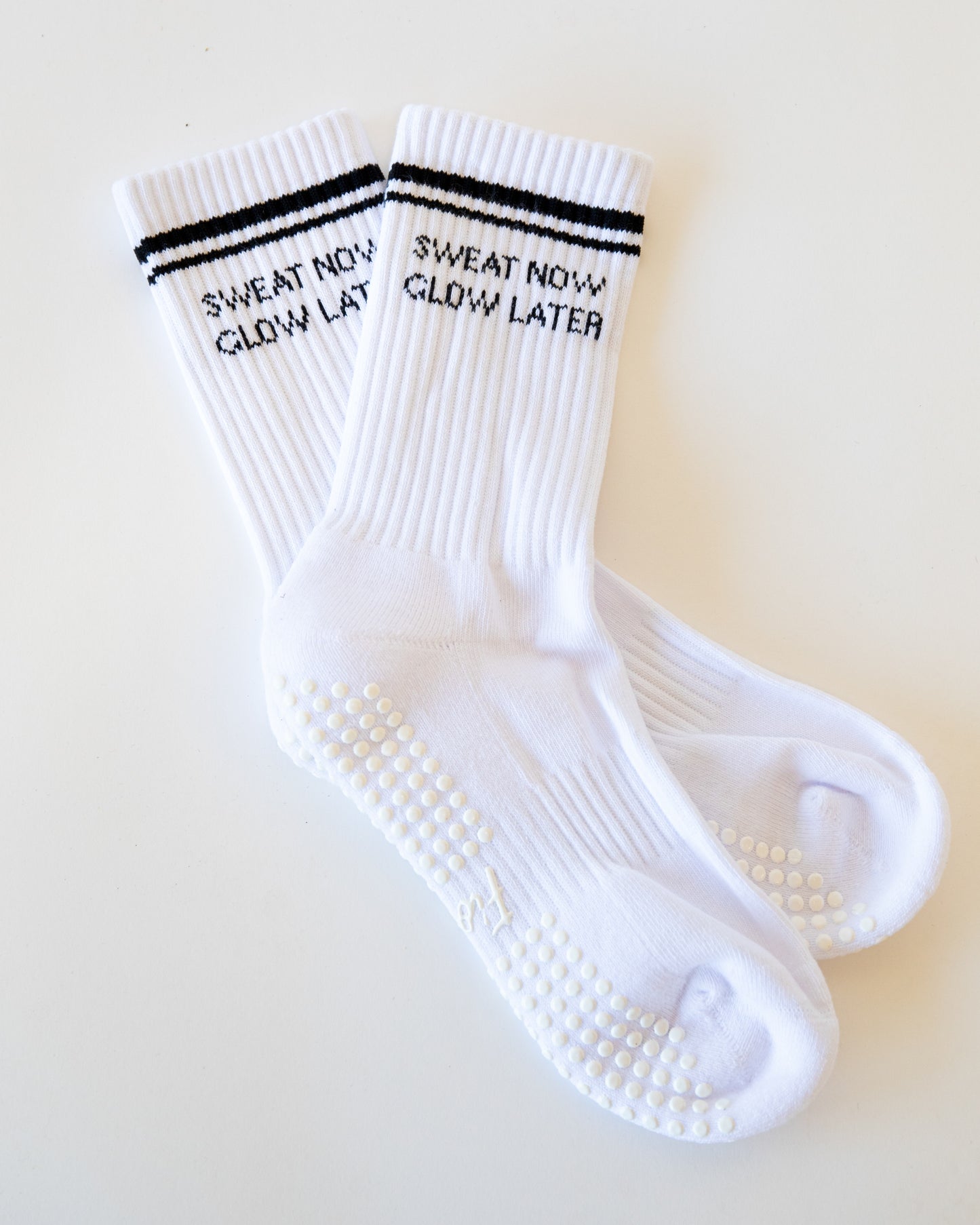 "SWEAT NOW GLOW LATER" GRIPPIES